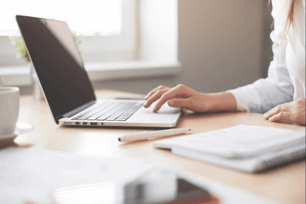 Close up of a woman using a laptop